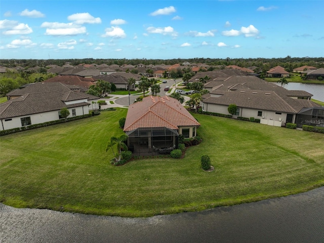 drone / aerial view with a water view