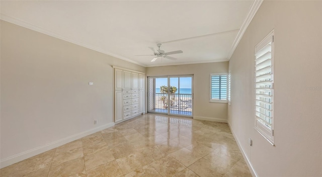 spare room featuring ceiling fan, baseboards, and crown molding