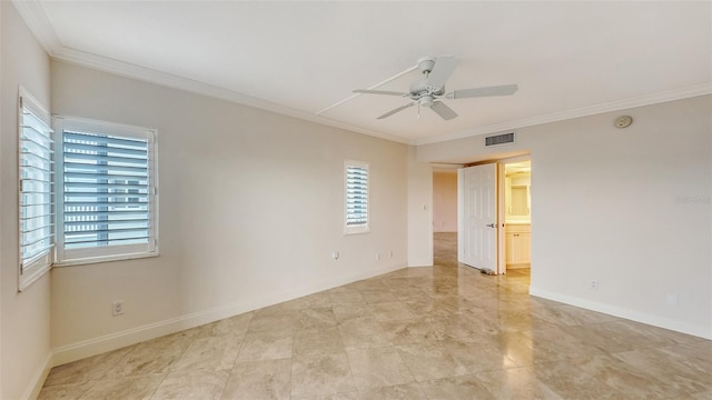 spare room with ornamental molding, visible vents, baseboards, and a ceiling fan