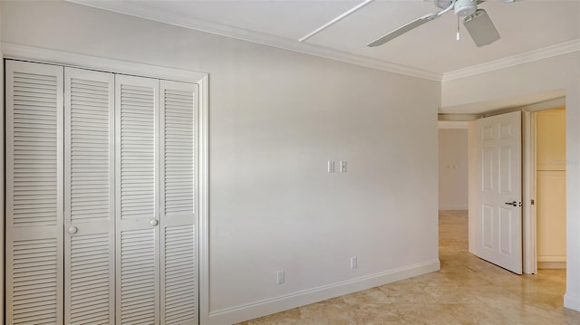 unfurnished bedroom with crown molding, baseboards, ceiling fan, and a closet