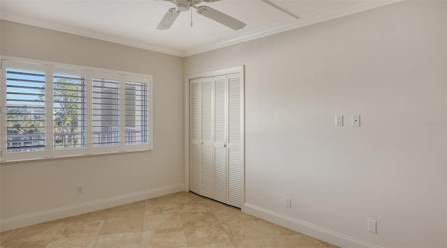 unfurnished bedroom featuring ornamental molding, a closet, ceiling fan, and baseboards