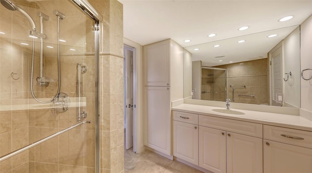 full bathroom featuring a stall shower, tile patterned floors, vanity, a closet, and recessed lighting