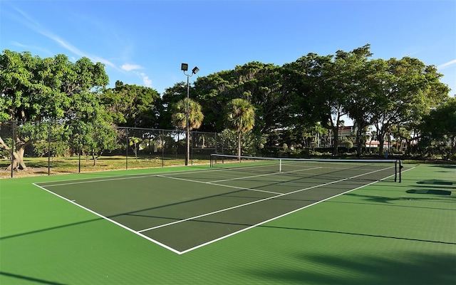 view of sport court with fence