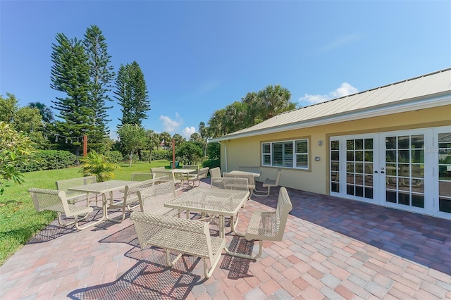 view of patio featuring french doors and outdoor dining space