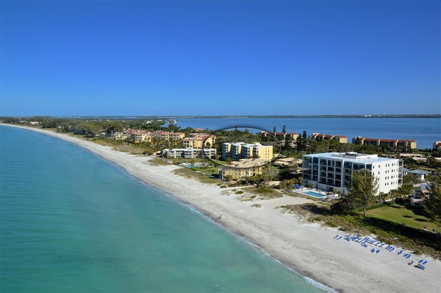 aerial view with a view of the beach and a water view