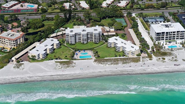 bird's eye view with a water view and a view of the beach