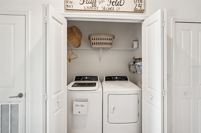 washroom featuring washing machine and dryer