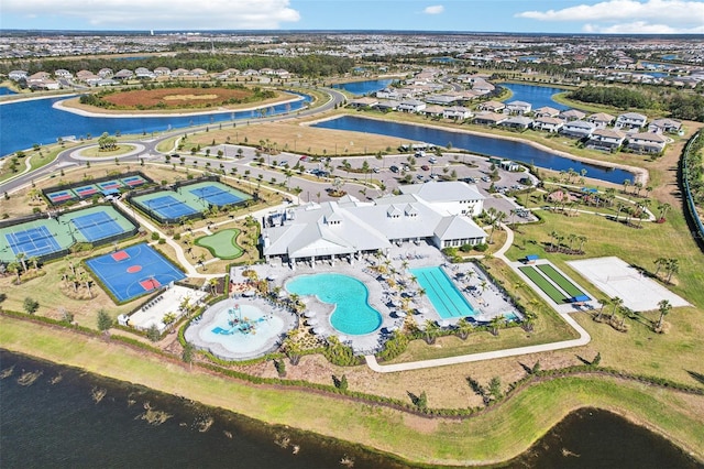 birds eye view of property with a water view