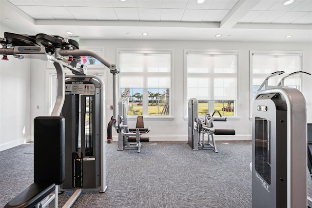 exercise room featuring dark colored carpet