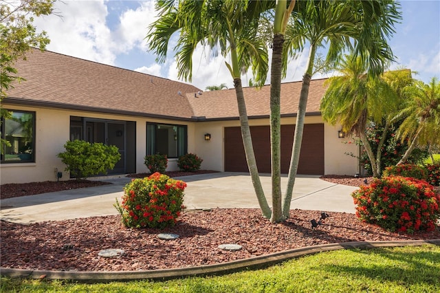 ranch-style home featuring a garage