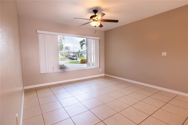 tiled empty room with ceiling fan