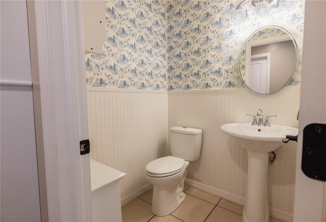 bathroom featuring tile patterned floors and toilet