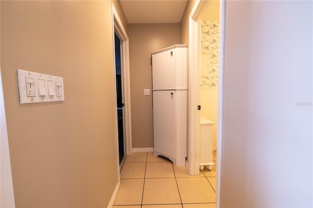 hall with light tile patterned flooring