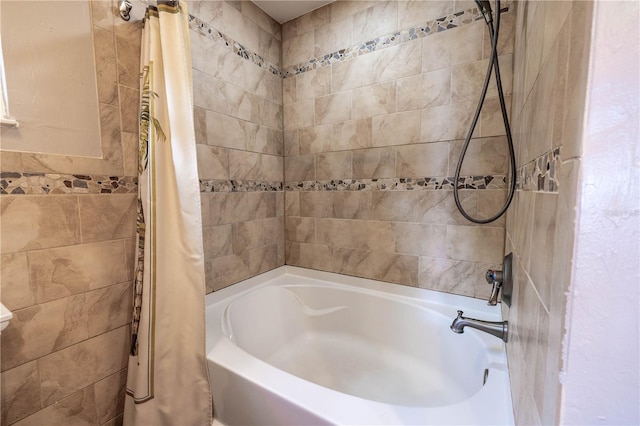 bathroom with shower / bath combo with shower curtain