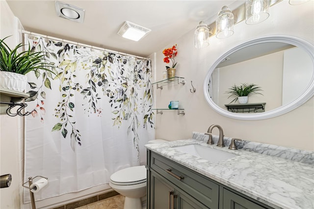 full bathroom with toilet, shower / bath combo, vanity, and tile patterned floors