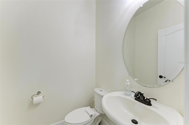 bathroom featuring sink and toilet