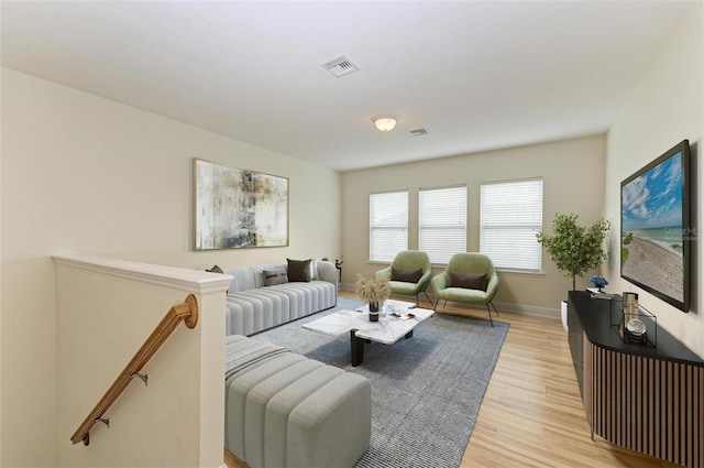 living room with light hardwood / wood-style flooring