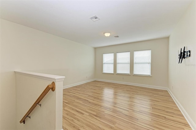 spare room featuring light hardwood / wood-style floors