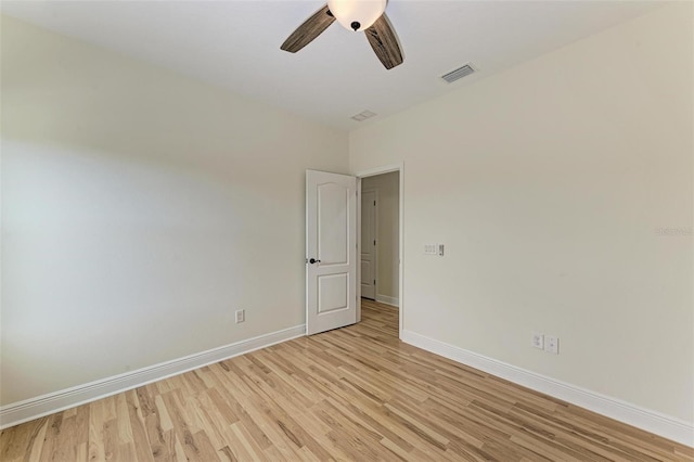 empty room with light wood-type flooring and ceiling fan