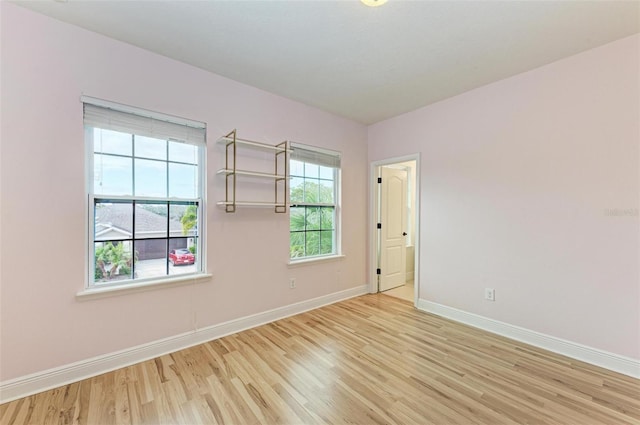 unfurnished room featuring light hardwood / wood-style floors