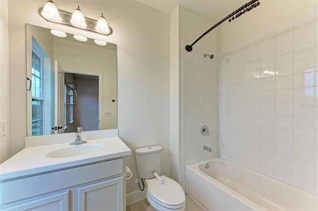 full bathroom with vanity, toilet, and tiled shower / bath