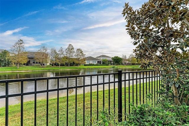 exterior space with a yard and a water view