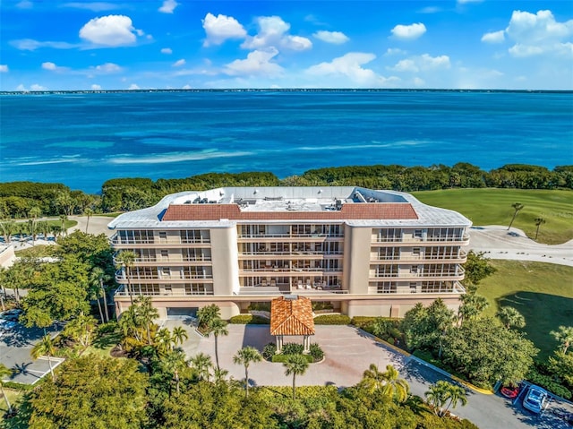 birds eye view of property with a water view