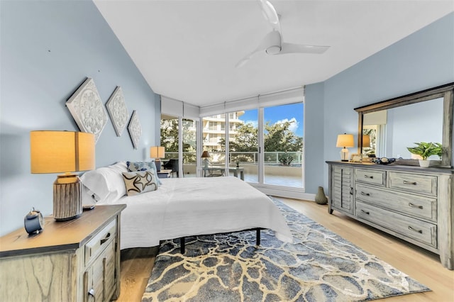 bedroom featuring access to outside, ceiling fan, and light hardwood / wood-style floors