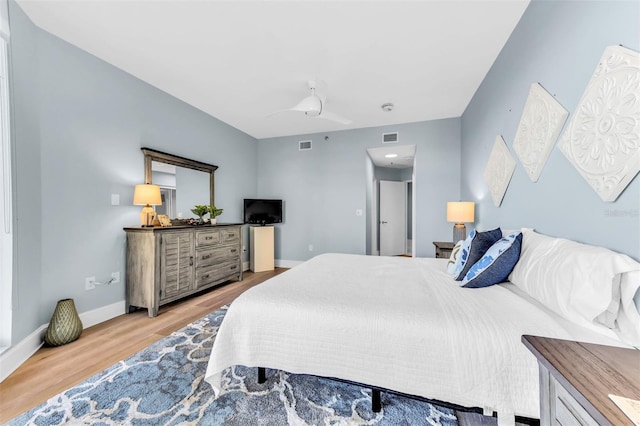 bedroom featuring hardwood / wood-style flooring and ceiling fan