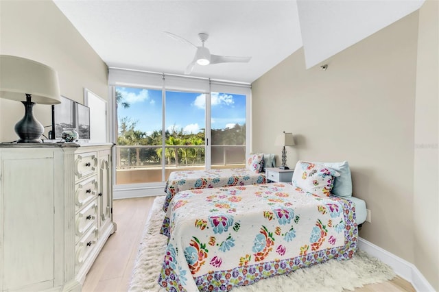 bedroom with ceiling fan and light hardwood / wood-style flooring