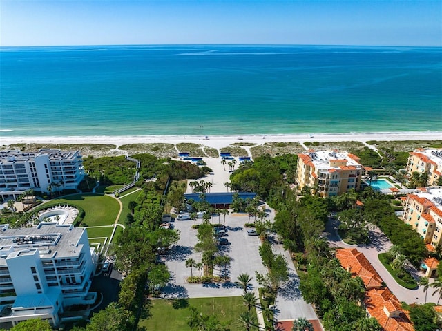 aerial view with a water view and a view of the beach