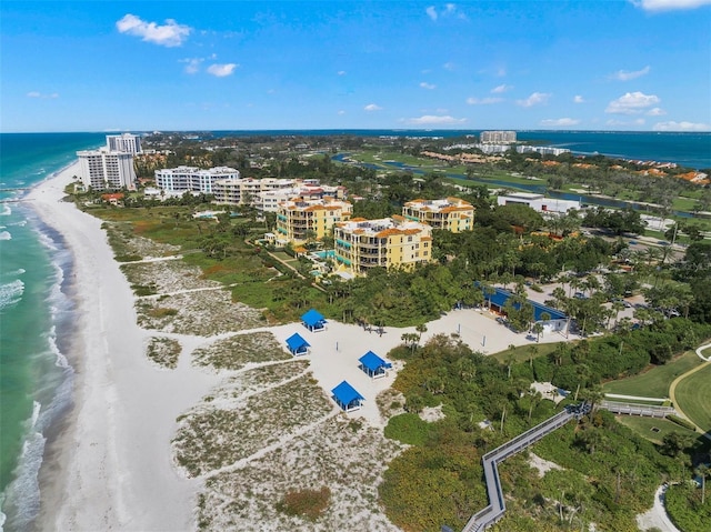 bird's eye view featuring a water view and a view of the beach