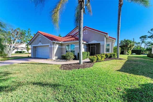 view of front of home with a front yard and a garage