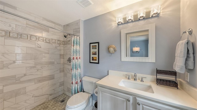 bathroom featuring vanity, toilet, and a shower with curtain