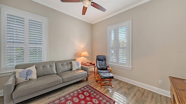 living room with ceiling fan, hardwood / wood-style floors, and ornamental molding