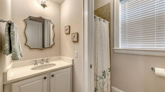 bathroom with vanity and walk in shower