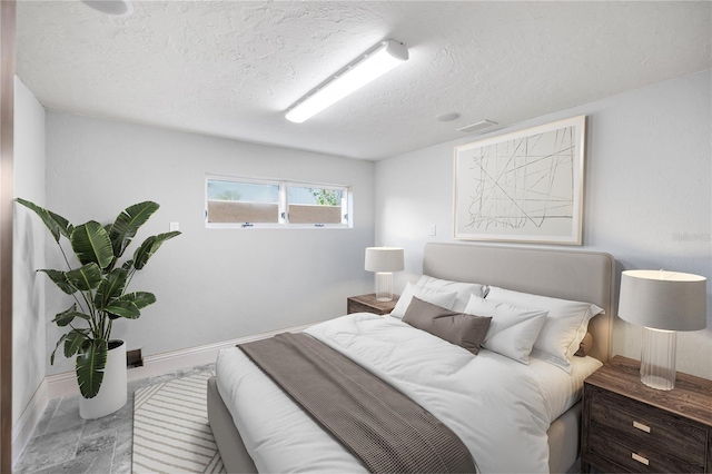 bedroom featuring a textured ceiling