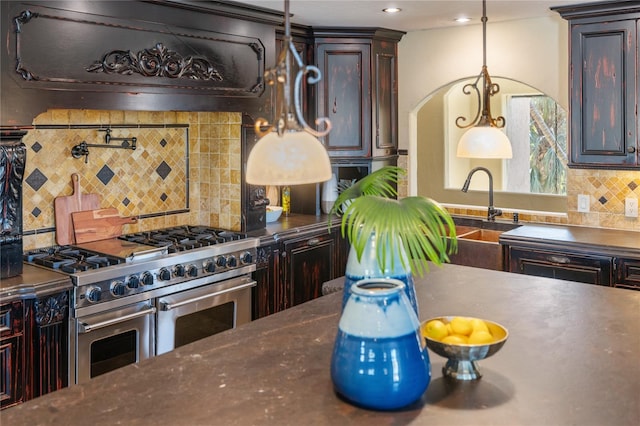 kitchen with backsplash, dark brown cabinetry, extractor fan, and range with two ovens