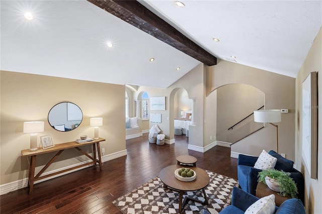 living room featuring dark hardwood / wood-style floors and lofted ceiling with beams