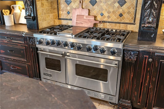 kitchen with decorative backsplash, double oven range, and dark brown cabinets