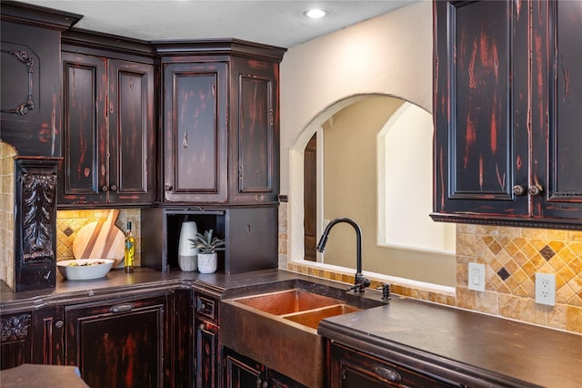 kitchen featuring tasteful backsplash and sink