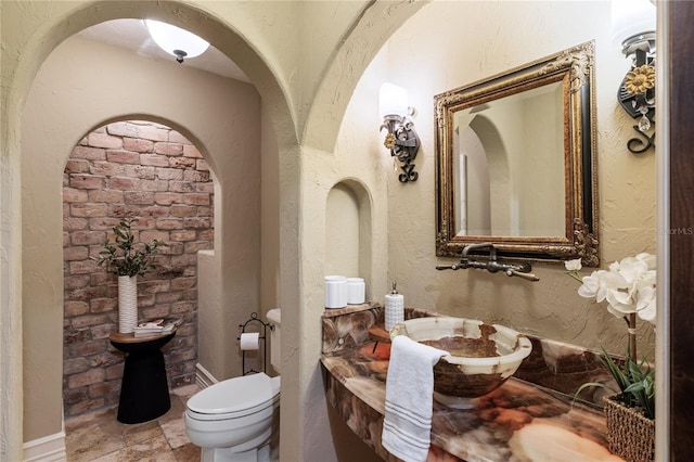 bathroom with sink and toilet