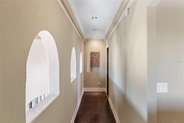 hall with dark hardwood / wood-style floors and ornamental molding