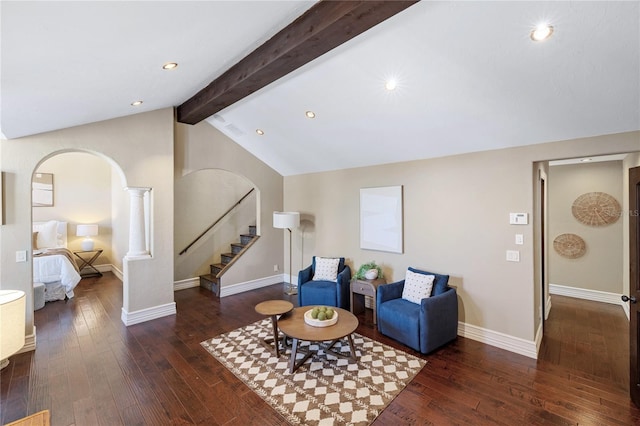 interior space with dark hardwood / wood-style flooring and lofted ceiling with beams