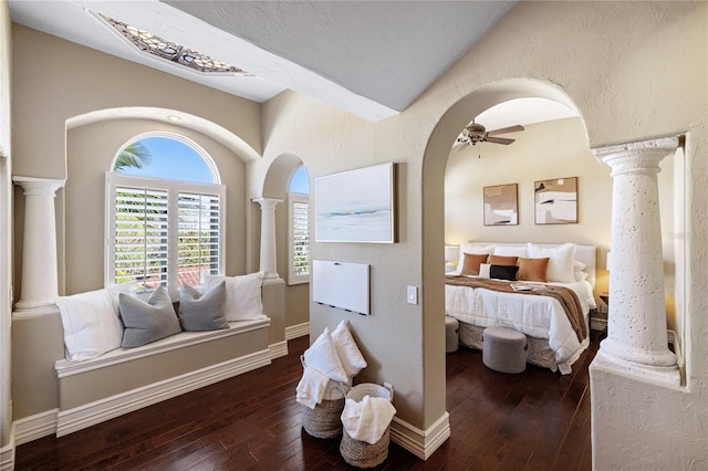 bedroom with ceiling fan, dark wood-type flooring, and vaulted ceiling