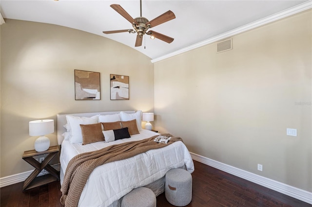 bedroom featuring ceiling fan, dark hardwood / wood-style flooring, and vaulted ceiling