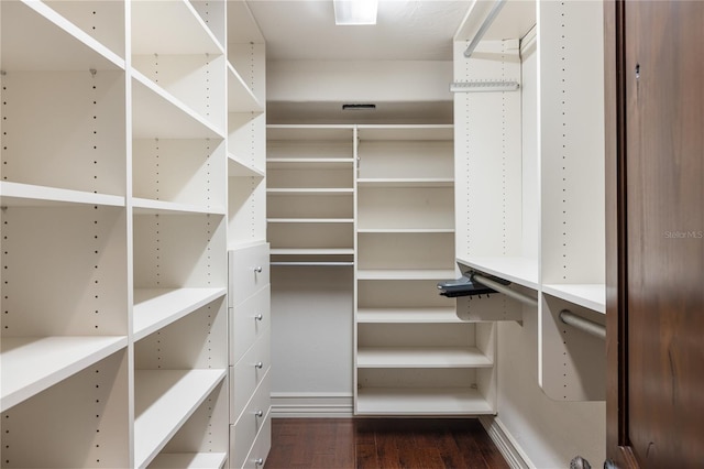 8855 Midnight Pass Rd, Sarasota, FL 34242 - spacious closet featuring wood finished floors