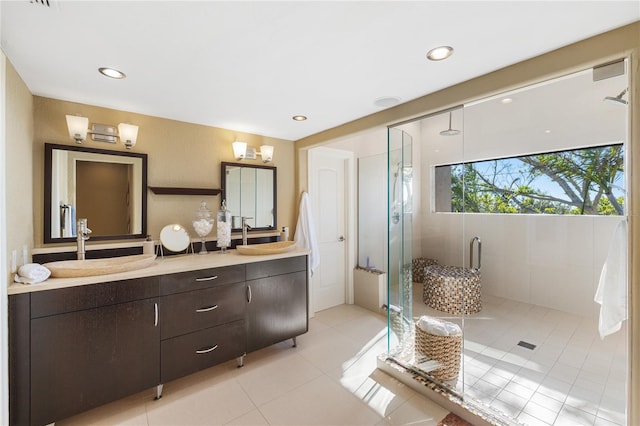 bathroom featuring vanity, tile patterned floors, and a shower with shower door