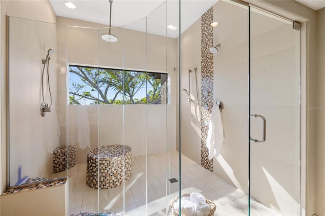 bathroom featuring tile patterned floors and a shower with door