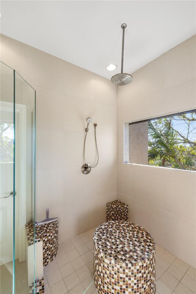 8855 Midnight Pass Rd, Sarasota, FL 34242 - bathroom featuring tiled shower and tile patterned flooring